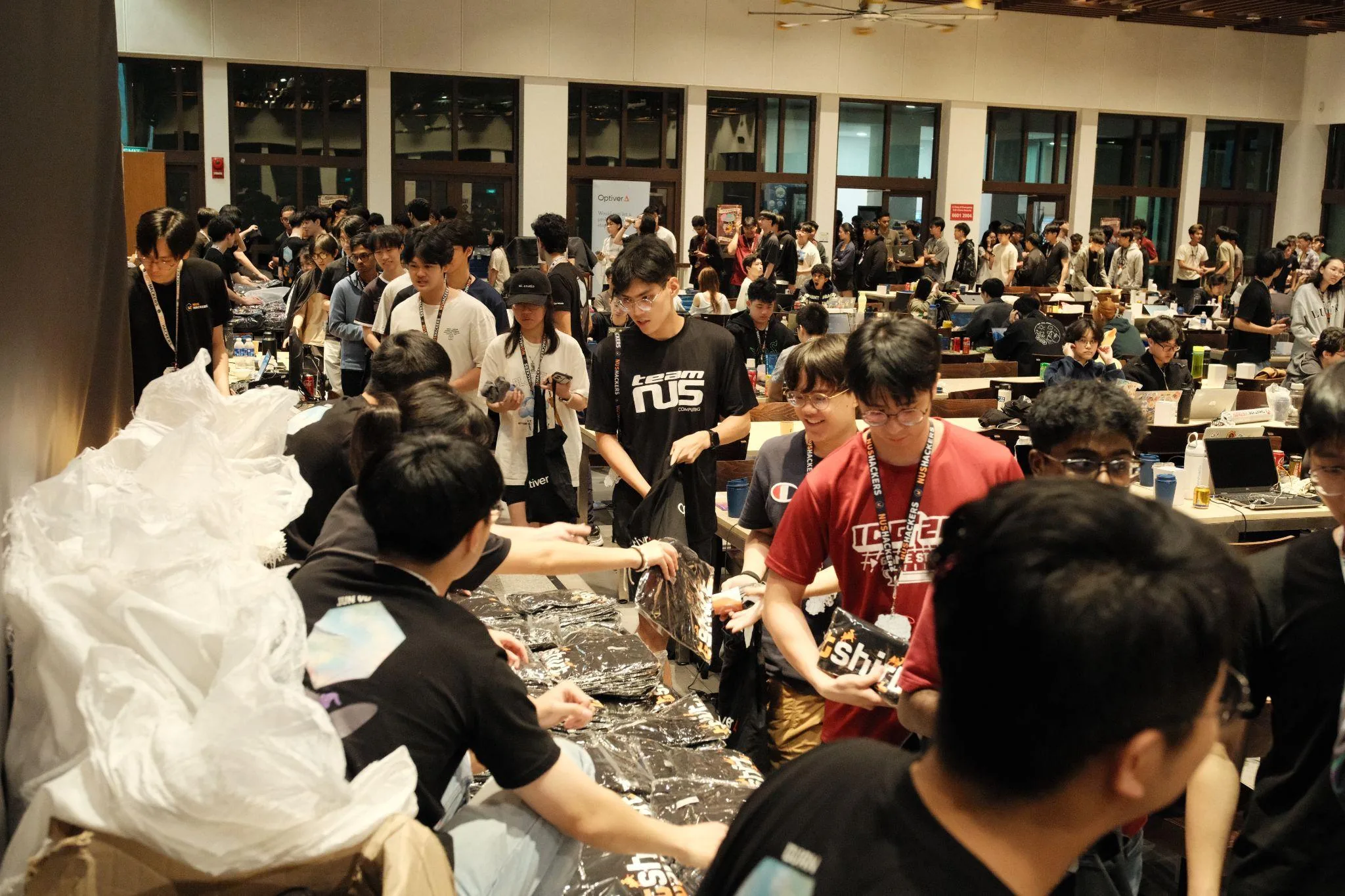 Organisers sorting and distributing Hack&Roll 2026 swag